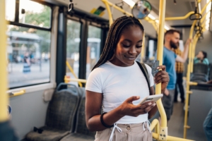 Experiential marketing promotional marketing with a lady on a bus on her phone engaging